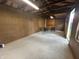Spacious garage featuring pegboard walls and seating area with accent rug at 2845 12Th St, Columbus, IN 47201
