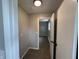 Neutral hallway featuring painted walls, carpeted floor and views into a bedroom at 2845 12Th St, Columbus, IN 47201