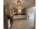 Spacious kitchen with stainless steel appliances, neutral walls, modern cabinets, and tile flooring at 2845 12Th St, Columbus, IN 47201