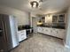 Kitchen with stainless steel appliances, neutral walls and cabinets, and light hard flooring at 2845 12Th St, Columbus, IN 47201