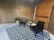 Enclosed patio featuring a patterned rug, seating area, and plants at 2845 12Th St, Columbus, IN 47201