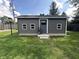Exterior view of a backyard shed with gray siding and well-maintained lawn at 2845 12Th St, Columbus, IN 47201