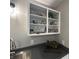 Close up of the kitchen shelving with decor, above gray countertops, and stainless steel sink at 2845 12Th St, Columbus, IN 47201