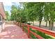 Red wooden deck overlooking the backyard with mature trees and grassy area at 3067 Stilton Dr, Cicero, IN 46034