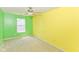 Bright bedroom featuring green and yellow walls, a ceiling fan, and a window at 3067 Stilton Dr, Cicero, IN 46034