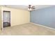 Bright bedroom with a fan, carpeted floors, and convenient access to a private bath area at 3067 Stilton Dr, Cicero, IN 46034