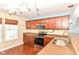 Kitchen with stainless steel appliances, granite countertops and hardwood floors at 3067 Stilton Dr, Cicero, IN 46034