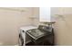 Convenient laundry room featuring modern washer and dryer units and wire shelving for organized storage at 3067 Stilton Dr, Cicero, IN 46034