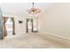 Bright living room features windows, a ceiling fan and glass door to the backyard at 3067 Stilton Dr, Cicero, IN 46034