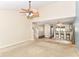 Open-concept living room with stairs, a view into the kitchen and lots of natural light at 3067 Stilton Dr, Cicero, IN 46034