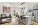 Stylish kitchen island with bar seating and modern stainless-steel appliances at 35 N Keystone Ave, Indianapolis, IN 46201