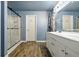 Bathroom features an updated vanity and a sliding glass shower door at 4223 Kestrel Ct, Indianapolis, IN 46254