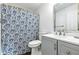 Well-lit bathroom with a vanity and decorative shower curtain at 4223 Kestrel Ct, Indianapolis, IN 46254