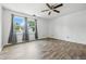 Bright bedroom features hardwood floors, a ceiling fan, and lots of natural light at 4223 Kestrel Ct, Indianapolis, IN 46254