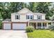 Inviting two-story home with a two car garage, classic shutters, and a charming front porch at 4223 Kestrel Ct, Indianapolis, IN 46254