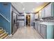 Stylish kitchen featuring stainless steel appliances, gray cabinetry, and sleek countertops at 4223 Kestrel Ct, Indianapolis, IN 46254