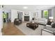 Bright living room features a fireplace, modern decor, and ample natural light at 4223 Kestrel Ct, Indianapolis, IN 46254
