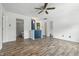 Open living area with hardwood floors and an open view to the kitchen at 4223 Kestrel Ct, Indianapolis, IN 46254