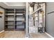 Spacious utility room includes shelving system, modern furnace, and laminate floors at 4223 Kestrel Ct, Indianapolis, IN 46254