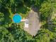 Aerial view of house and pool surrounded by a mature tree canopy at 429 Glenbrook Ln, Avon, IN 46123