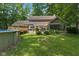 Beautiful backyard with a deck, above-ground pool, and mature landscaping at 429 Glenbrook Ln, Avon, IN 46123