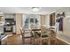 Cozy dining area with an ample table, chairs, and access to the outside at 429 Glenbrook Ln, Avon, IN 46123