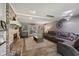 Spacious living room featuring a brick fireplace, comfortable seating, and sliding glass doors at 429 Glenbrook Ln, Avon, IN 46123
