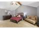 Cozy carpeted main bedroom showcases a sitting area and attractive dresser at 429 Glenbrook Ln, Avon, IN 46123