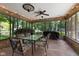 Charming sunroom with dining set, brick foundation, and backyard views at 429 Glenbrook Ln, Avon, IN 46123