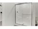 Modern shower with glass doors, a built-in bench, and sleek fixtures at 4379 Red Pine Dr, Bargersville, IN 46106