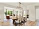 Open-concept living and dining area featuring a modern light fixture and plenty of natural light at 4379 Red Pine Dr, Bargersville, IN 46106