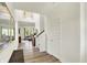 Bright, two-story foyer featuring wood-look floors and an open view to the living room area at 4379 Red Pine Dr, Bargersville, IN 46106
