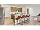 A kitchen featuring a large island with barstool seating, stainless steel appliances, and plenty of cabinets at 4379 Red Pine Dr, Bargersville, IN 46106
