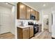 Well-lit kitchen with granite countertops, stainless steel appliances, and ample cabinet space at 4379 Red Pine Dr, Bargersville, IN 46106