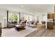 Open-concept living room and dining area with a view of the kitchen, designed for modern living and entertaining at 4379 Red Pine Dr, Bargersville, IN 46106