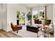 Cozy living room with lots of natural light, a comfortable seating area, and views of the backyard at 4379 Red Pine Dr, Bargersville, IN 46106