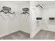 Bright walk-in closet featuring white walls, gray carpet, wire shelving, and hanging racks for optimal storage at 4379 Red Pine Dr, Bargersville, IN 46106
