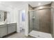 Bathroom featuring a glass shower, modern vanity, and elegant tile flooring at 4382 Red Pine Dr, Bargersville, IN 46106