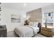 Comfortable bedroom with a wood accent wall, ambient lighting, and stylish furnishings at 4382 Red Pine Dr, Bargersville, IN 46106
