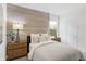 Stylish bedroom with wood accent wall, natural light, and tasteful decor for a relaxing ambiance at 4382 Red Pine Dr, Bargersville, IN 46106