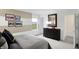 Well-lit bedroom featuring a comfy bed, stylish decor, and a glimpse of the peaceful outdoor view at 4382 Red Pine Dr, Bargersville, IN 46106