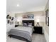 Inviting bedroom featuring a striped accent wall, comfortable bed, and tasteful decor, offering a cozy retreat at 4382 Red Pine Dr, Bargersville, IN 46106