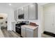 Well-equipped kitchen with gray cabinetry, stainless steel appliances, and ample counter space for cooking and preparation at 4382 Red Pine Dr, Bargersville, IN 46106