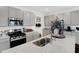 This kitchen features stainless steel appliances, granite countertops, and stylish gray cabinetry at 4382 Red Pine Dr, Bargersville, IN 46106