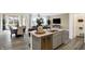 Spacious kitchen with a center island, stainless steel dishwasher, and open floor plan integrating living and dining spaces at 4382 Red Pine Dr, Bargersville, IN 46106