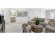Bright living room featuring a sectional sofa, stylish decor, and an open layout, perfect for relaxing and entertaining guests at 4382 Red Pine Dr, Bargersville, IN 46106