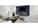 Modern living room showcasing a comfortable sectional, stylish decor, and a media console, creating an inviting entertainment space at 4382 Red Pine Dr, Bargersville, IN 46106