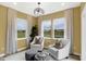 Relaxing living space with views of the water, stylish chairs, and soft natural light at 4382 Red Pine Dr, Bargersville, IN 46106