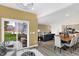 Open-concept living space featuring modern decor, wood floors, and a sliding glass door to the outdoors at 4382 Red Pine Dr, Bargersville, IN 46106