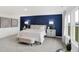 Charming main bedroom features blue accent wall, bedside lamps, and cozy furnishings at 4382 Red Pine Dr, Bargersville, IN 46106
